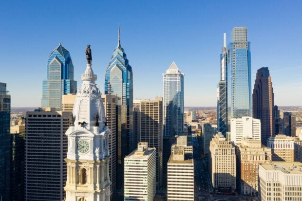 Philadelphia skyline towers and historic architecture under a clear blue sky