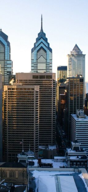 Tall buildings in the Philly skyline captured at sunset with clear skies