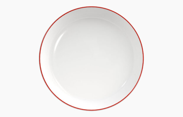 White plate with a thin red edge shown from above on a plain background