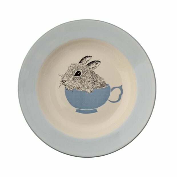 A detailed drawing of a rabbit inside a blue cup on a ceramic plate