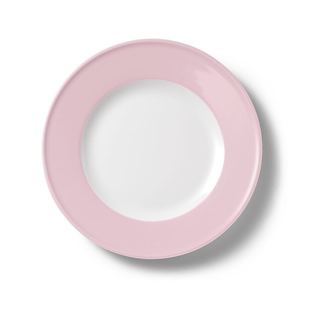 A round plate with a pink rim and white center isolated on a white background