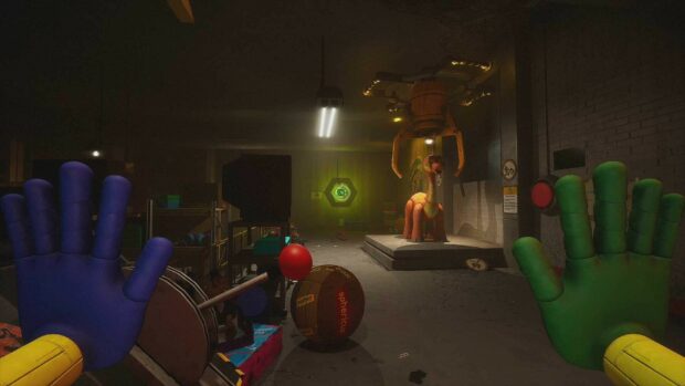 A first person view of the grab pack hands in a dark room with toys and a mechanical claw in Poppy Playtime