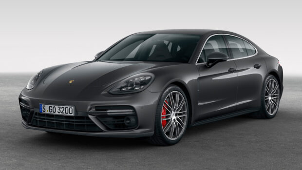 Black Porsche Panamera car parked on a gray surface with sleek design and red brake calipers