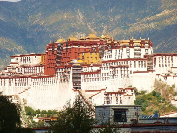 The Potala Palace with detailed architecture against mountain backdrop