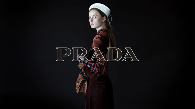 A model wearing a Prada outfit and holding a Prada handbag against a black background