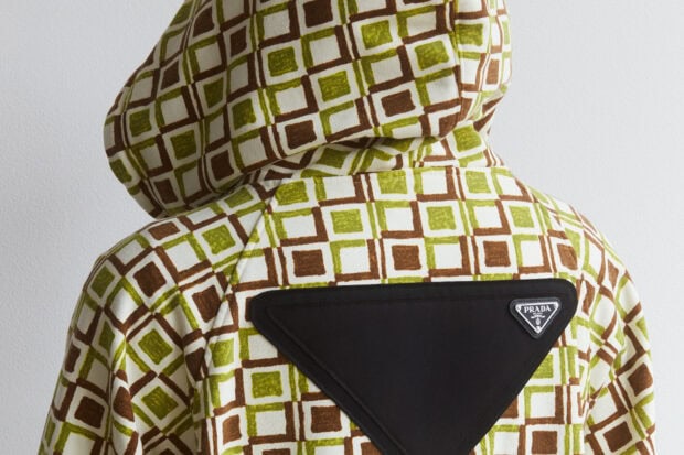 Green and brown geometric pattern with a Prada logo on the back of the garment