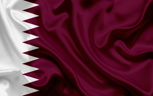Smooth fabric of Qatar flag showing maroon and white colors