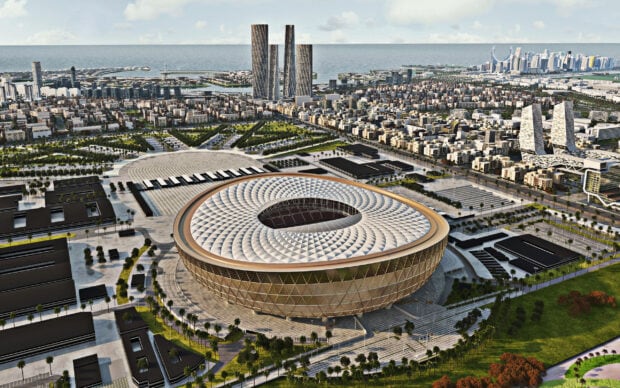Iconic architecture of stadium in Qatar cityscape with modern buildings and sea view