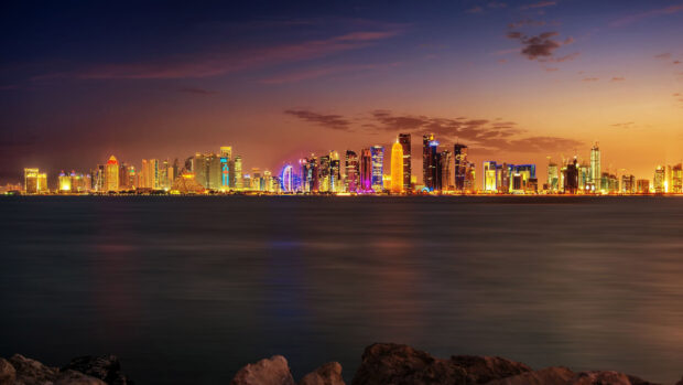 Stunning Qatar cityscape at sunset showcasing modern architecture and vibrant lights
