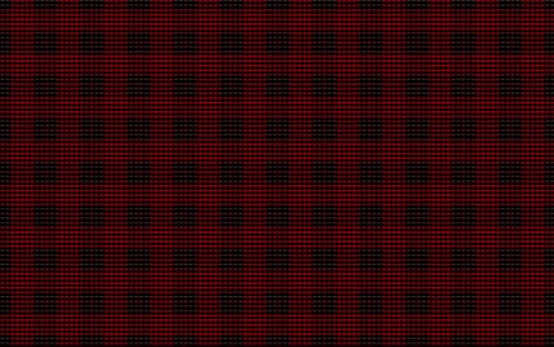 A digital pattern featuring red checked design on a dark textured surface