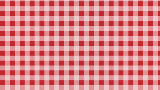 Red checked pattern with alternating shades of red and pink squares in a seamless design