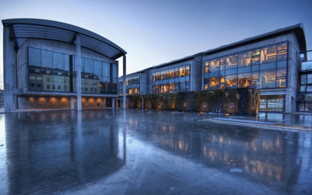 Modern Reykjavik architecture reflecting on icy surface during dusk