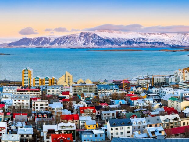 Colorful Reykjavik city buildings with mountains in the background