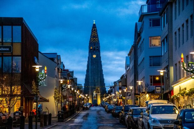 Evening street view with Reykjavik cathedral illuminated in the background