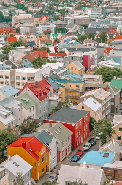 A colorful Reykjavik neighborhood with vibrant rooftops and diverse buildings in an urban setting