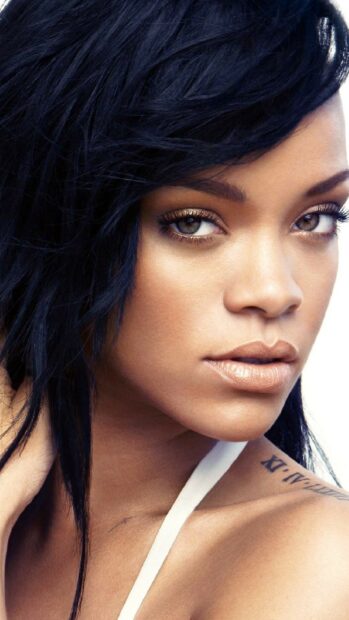 Close up of Rihanna showcasing natural makeup and dark hair hairstyle