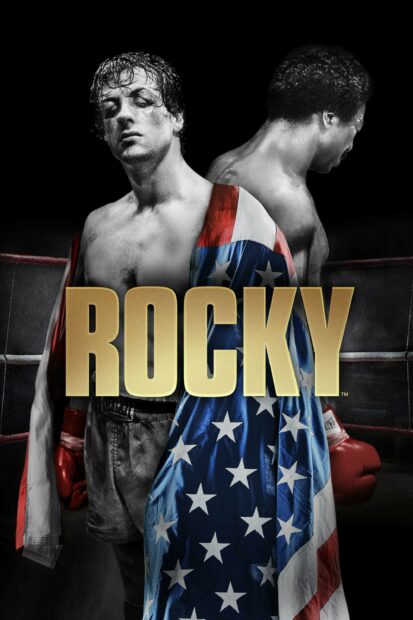 Rocky standing in a boxing ring with an American flag robe and red gloves