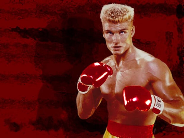 Rocky character wearing red boxing gloves in fighting pose on red background