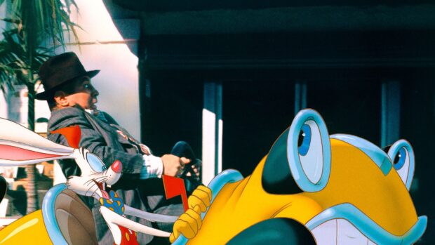 Roger Rabbit driving a yellow cartoon car with a man in a hat sitting beside him