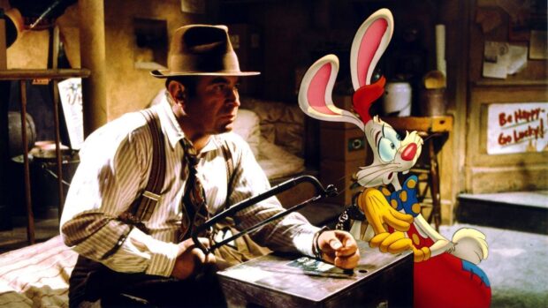 A man holding a hacksaw next to Roger Rabbit sitting in a chair in a dimly lit room