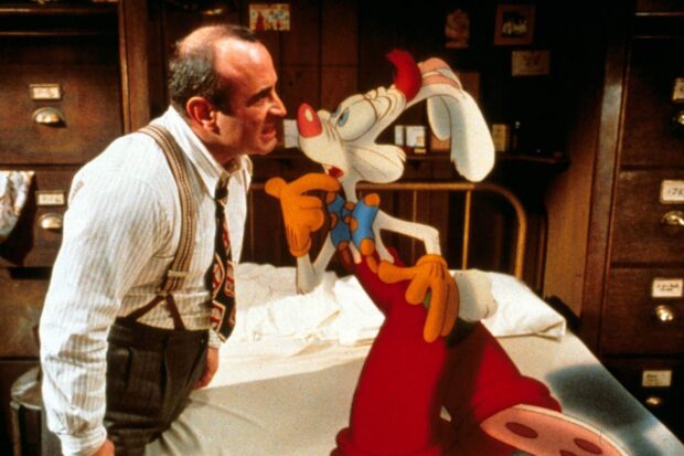 A man in suspenders arguing with Roger Rabbit in a vintage room setting