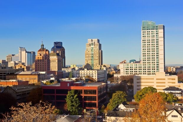 Historic Sacramento skyline with modern buildings under a clear blue sky