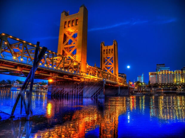 Sacramento Tower bridge illuminated at night in Sacramento cityscape