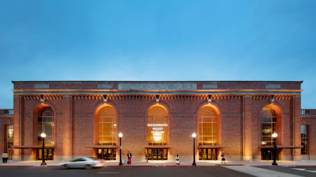 Historic Sacramento Valley Station building with warm lights at dusk