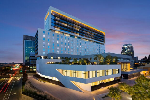 Modern building architecture in Sacramento at dusk with city lights