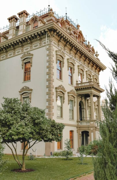Ornate Sacramento architecture with lush garden in front of the building