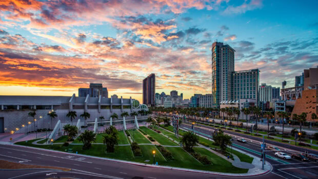 The San Antonio Texas skyline with green park and colorful sunset sky in the background