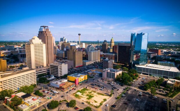 Aerial view of San Antonio Texas skyline with clear blue sky and city buildings