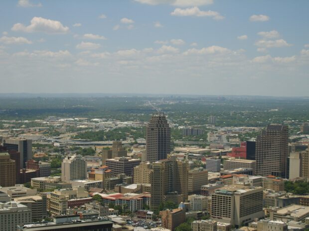 Aerial view of San Antonio Texas cityscape with skyscrapers and greenery
