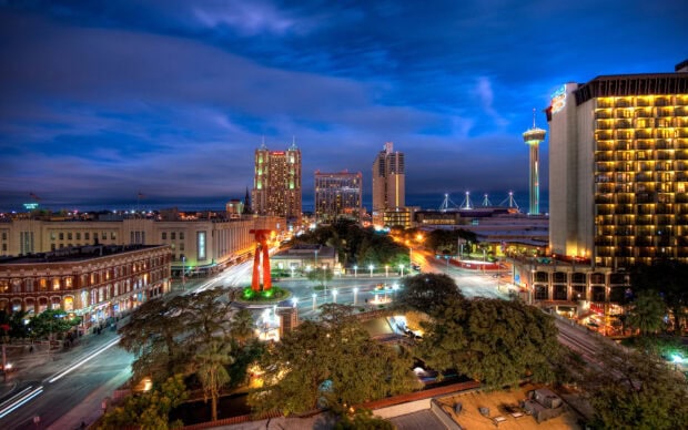 San Antonio Texas skyline with illuminated buildings and streets at night