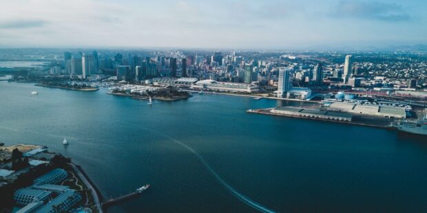 Aerial view of San Diego California city skyline and waterfront with boats on the bay