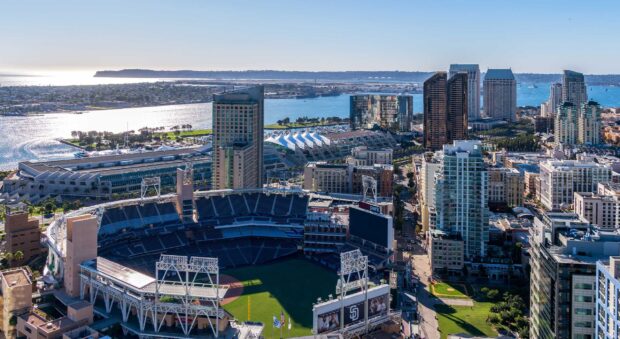 A panoramic view of San Diego California featuring the Petco Park stadium and downtown skyline along the waterfront