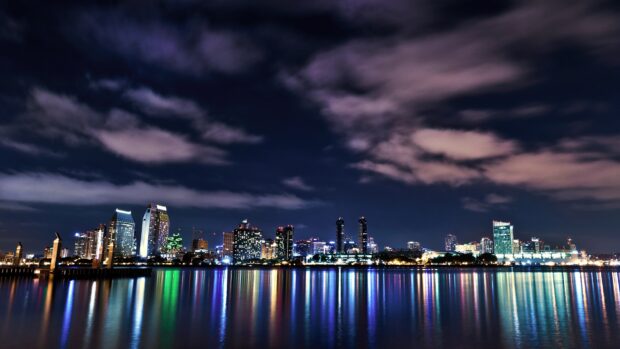 Night skyline of San Diego California with colorful reflections on water