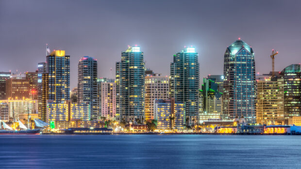 San Diego city skyline at night with high rise buildings and waterfront view