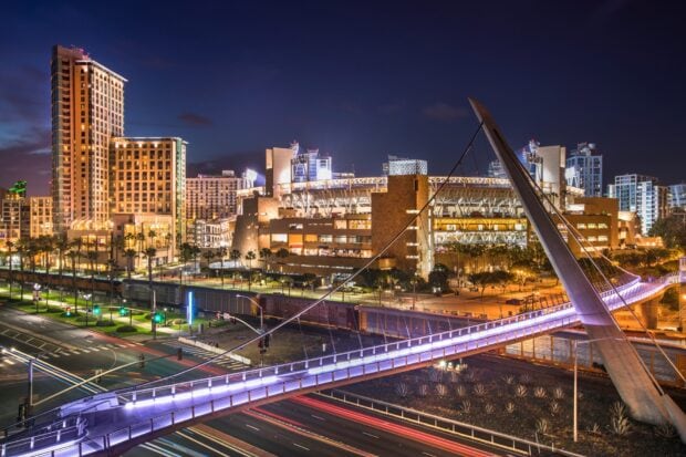 Night cityscape of San Diego California with illuminated bridge and buildings in high definition