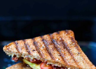 Grilled sandwich filled with bacon avocado and tomato on toasted bread