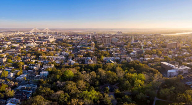 Aerial view of Savannah Georgia cityscape with historic buildings and green parks