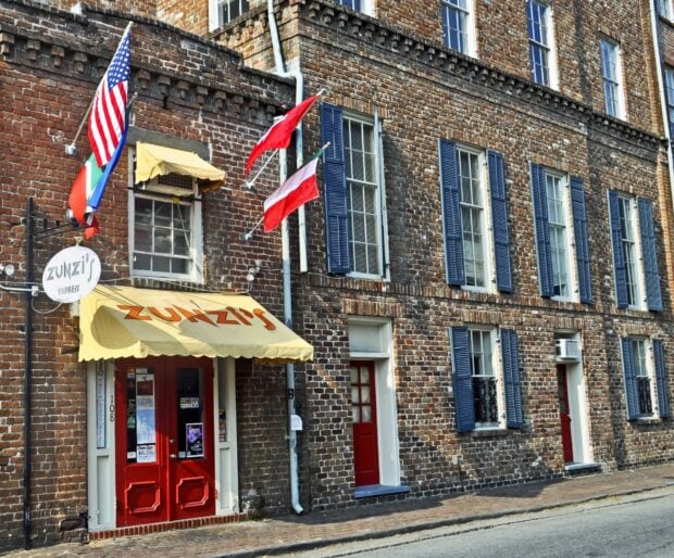 Historic brick building with colorful doors in Savannah Georgia
