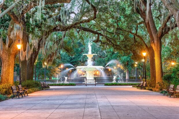 Historic fountain surrounded by moss covered trees in Savannah Georgia park