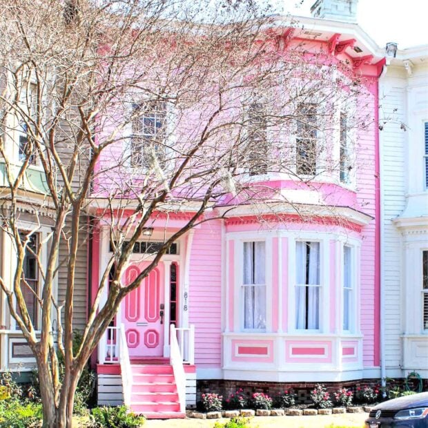 A charming Victorian style house in Savannah with pink walls and intricate details