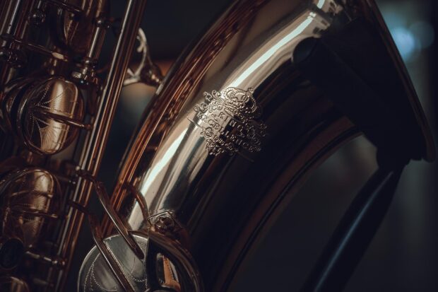 Close up of saxophone with detailed engravings on brass surface
