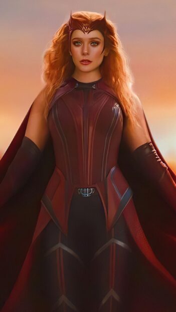 Scarlet Witch character standing confidently in red costume with glowing sunset background