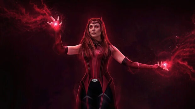Scarlet Witch character using magical powers with glowing red energy around her hands