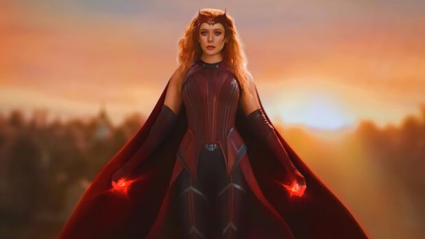 Scarlet Witch in a red costume using magical powers with a glowing sunset background