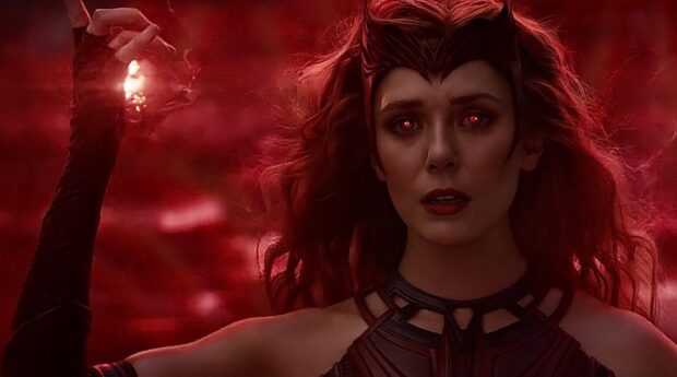Scarlet Witch character with glowing red eyes and magical powers in a dramatic dark red scene