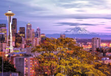 Seattle city skyline with Mount Rainier in the background at dusk